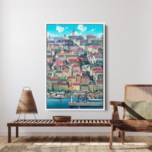 May include: A framed print of a colorful cityscape with buildings of various colors and architectural styles. The image includes a harbor with boats and a lighthouse. The sky is blue with fluffy white clouds.