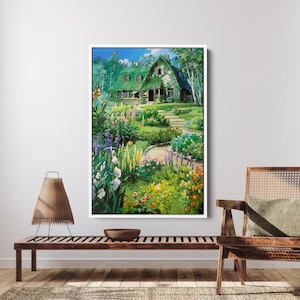 May include: A framed print of a cottage with a green roof, surrounded by a vibrant garden. The artwork features a winding stone path leading to the house, with colorful flowers and lush greenery. The sky is blue with some clouds.