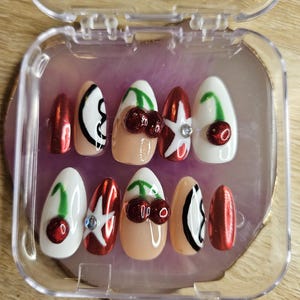 Cherry themed medium almond nails!