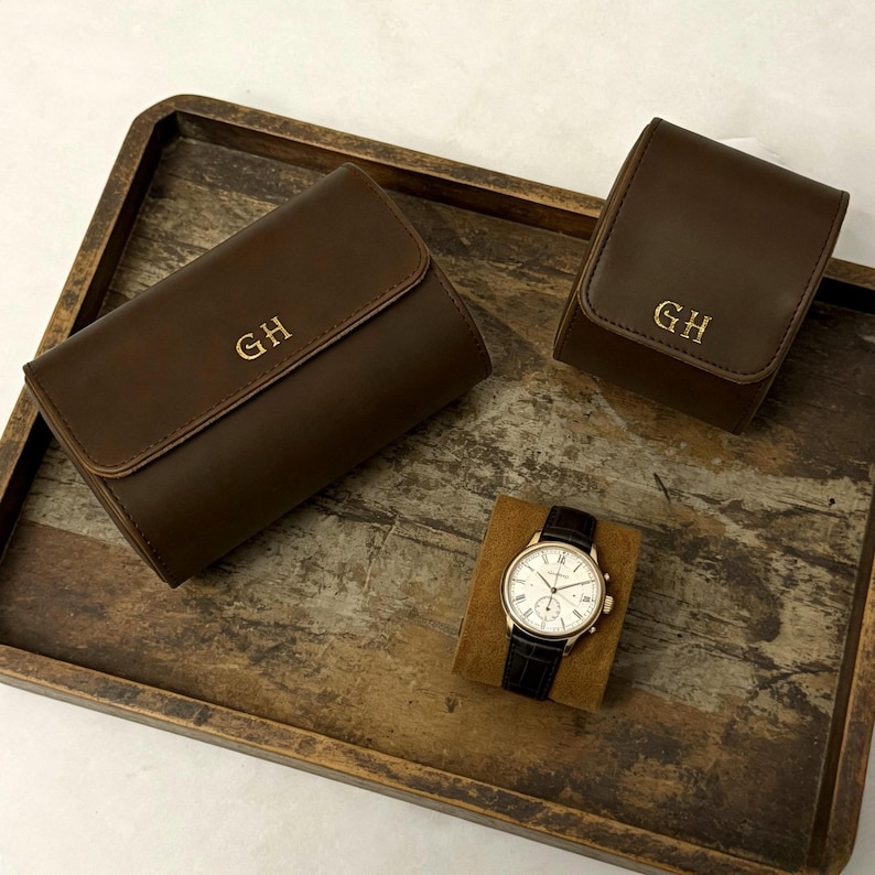 May include: A set of three ceramic mugs with a speckled, matte finish. The mugs are in shades of cream, light gray, and dark gray. Each mug has a simple, minimalist design, perfect for coffee or tea.