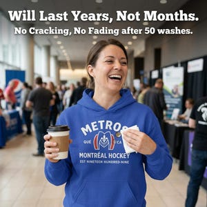 May include: A royal blue hooded sweatshirt featuring white and red graphic text that reads METROS QU&Eacute; MONTR&Eacute;AL HOCKEY EST NINETEEN HUNDRED-NINE. The text Will Last Years, Not Months. No Cracking, No Fading after 50 washes. is printed at the top.