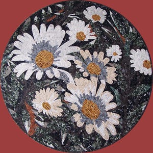 May include: Circular mosaic artwork depicting white daisies with yellow centres and grey detailing, set against a dark background with green and brown elements. The mosaic is likely made of small tiles.