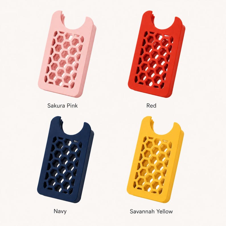 May include: Four colorful phone card holders in Sakura Pink, Red, Navy, and Savannah Yellow. Each holder has a honeycomb pattern and a curved top. The names of the colors are printed below each holder.