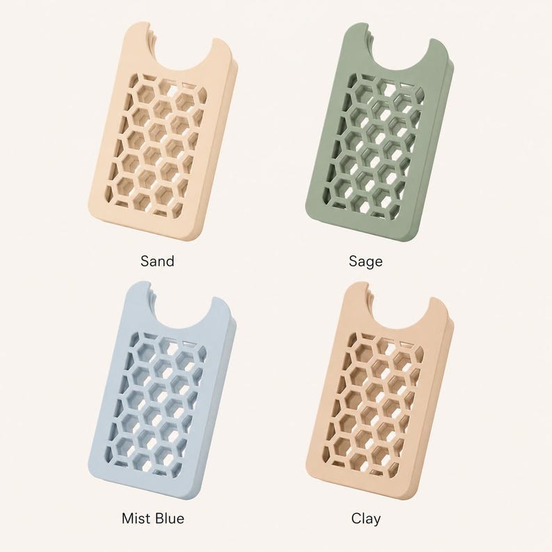 May include: Four phone card holders in sand, sage, mist blue, and clay colors. Each holder has a honeycomb pattern and a curved top. The names of the colors are printed below each holder.