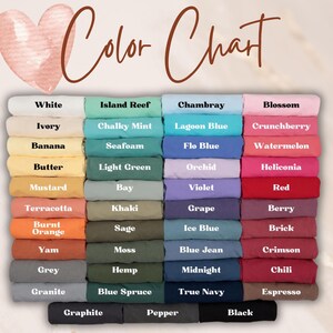 May include: A color chart displays a variety of fabric colors, including white, ivory, and black. The chart features a heart graphic and the words "Color Chart" in a handwritten font. The colors are arranged in neat rows.