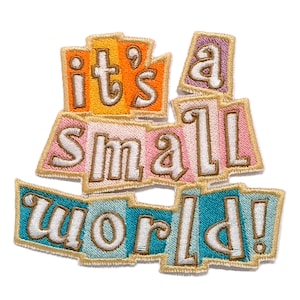 May include: Embroidered patch with the phrase "it's a small world!" in white letters. The patch has a retro design with a variety of colors, including orange, pink, blue, and purple. The edges are outlined in a gold color.