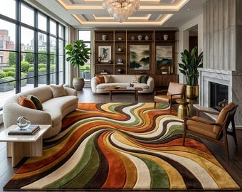 May include: A living room with a large, colorful area rug featuring a swirling pattern in shades of brown, orange, green, and cream. The room includes two curved cream-colored sofas, brown leather chairs, and a fireplace. Large windows offer a view of an outdoor terrace.