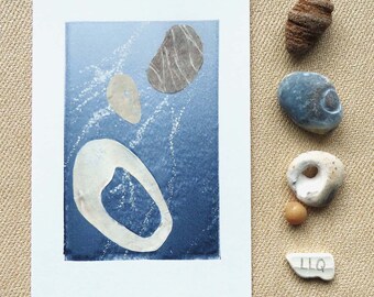 Original monoprint and mixed media art of pebbles submerged in the sea
