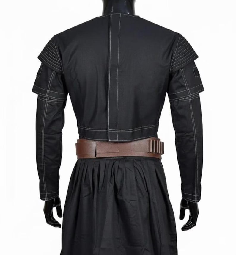 May include: A set of three ceramic mugs with a speckled, matte finish. The mugs are in shades of cream, light grey, and dark grey. Each mug has a simple, minimalist design and a rounded handle. The mugs are stacked on top of each other.