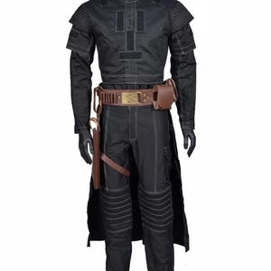 May include: Black costume featuring a long-sleeved top, trousers, and a belt with a gold buckle. The costume includes a brown holster and a pouch. White stitching details the outfit. The mannequin wears black gloves.