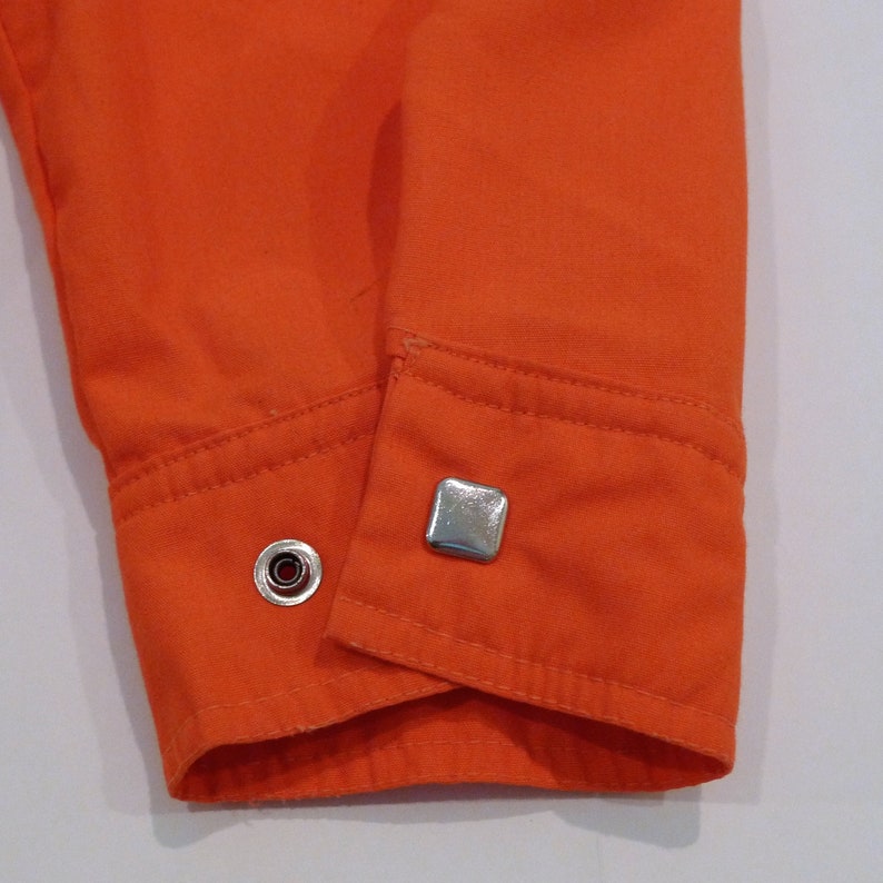 Obermeyer Western Shirt Jacket 1980s Vintage Decorative Metal Pearl Snap Ski Shirt with banded collar Orange Lightweight Overshirt VTG