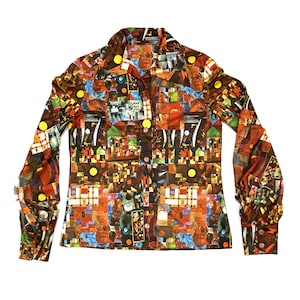 May include: A long-sleeved button-down shirt with a colorful, abstract pattern. The design features a collage of geometric shapes, buildings, and circular elements in shades of brown, orange, blue, and yellow. The shirt has a classic collar and buttoned cuffs.