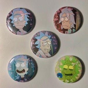 May include: Five round pinback buttons featuring the character Rick from the animated series. Each button has a different image of Rick with blue hair and a pink bow. The backgrounds vary in color and design.
