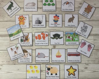 May include: A collection of square cards featuring illustrations and text from various nursery rhymes. The cards include images of animals, characters, and scenes from popular children's songs, such as "Twinkle Twinkle" and "Wheels on the Bus."