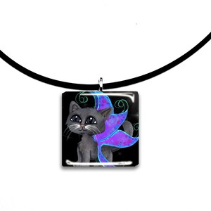 May include: A square pendant necklace featuring a gray cat with purple and blue butterfly wings against a black background. The cat has large eyes and a white whisker. The pendant hangs from a black cord.