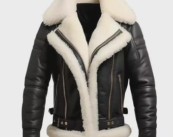 May include: Black leather jacket with a white shearling lining and collar. The jacket features a zip closure, side pockets, and a belt at the waist. The sleeves have a ribbed design and the cuffs are trimmed with shearling.