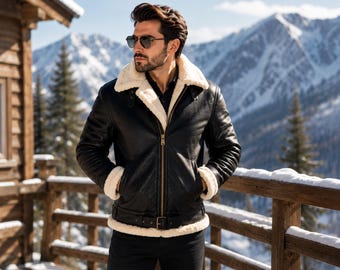 May include: A black leather jacket with a thick white shearling lining, a wide collar, a front zipper closure, and a buckled belt at the hem. The jacket features long sleeves with shearling cuffs and is worn over a dark shirt and dark trousers.