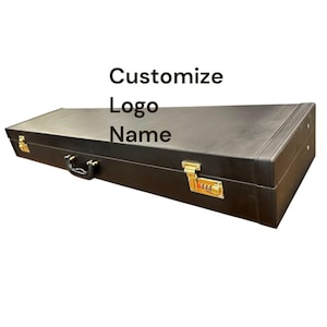 May include: A black rectangular case with gold-colored hardware, a handle, and a combination lock. The text "Customize Logo Name" is printed on the top of the case.