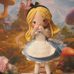 May include: A handmade crochet doll of Alice in Wonderland, with blonde hair and a blue and white dress. The doll is standing in front of a whimsical background. Text on the image reads "MADE BY MY LOVELY CUSTOMER" and "NH&Agrave; P&Ocirc;NG LEN HANDMADE CRAFTS".