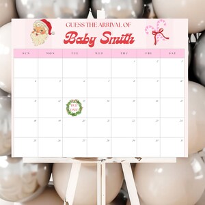 May include: A pink calendar on a white easel with the text "Guess the Arrival of Baby Smith." The calendar has a Santa Claus graphic and a candy cane graphic. The calendar is surrounded by silver and white balloons.