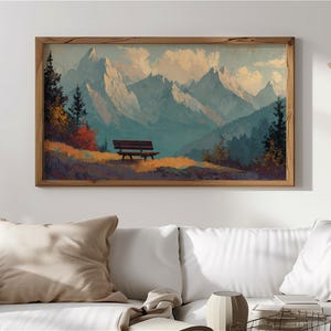 May include: A framed landscape painting depicts a mountain range under a cloudy sky. A wooden bench sits on a grassy hill in the foreground. The artwork features a warm color palette with shades of brown, green, and blue.