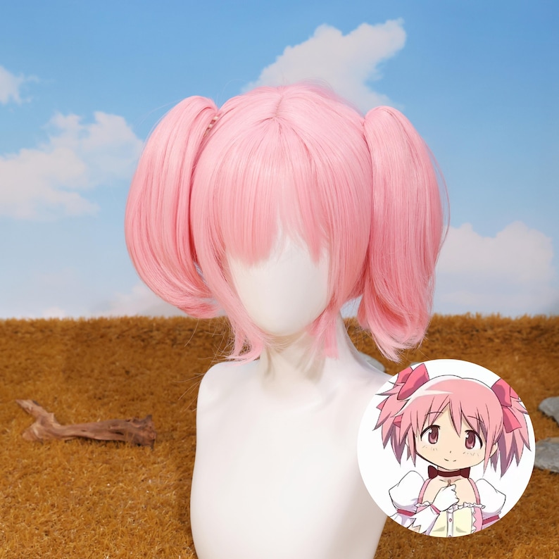 Madoka Kaname cosplay wig styled with soft pastel pink twin tails and parted bangs, designed for anime fans who love Puella Magi Madoka Magica. This high-quality synthetic wig features heat-resistant fibers, making it perfect for conventions, cosplay photoshoots, platform game player gifts, and birthday presents. The detachable twin tails attach easily with secure tiger-mouth clips, allowing flexible styling. Ideal for magical girl transformations and anime costume collections.