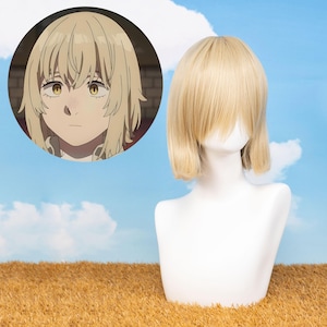 May include: A light blonde wig with a short, layered style, displayed on a white mannequin head. The wig features a blunt fringe and a side part. An anime-style illustration of a character with similar hair is in the background.
