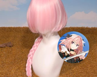 May include: A pink wig with a short, layered style and a long braid. The wig is displayed on a mannequin head. A circular image of an anime character is visible on the right side of the mannequin.