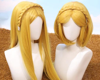 May include: Two blonde wigs on white mannequin heads. One wig has long, straight hair, and the other has a shorter, bobbed style. Both wigs feature a braided headband. The background is a light blue sky and brown surface.