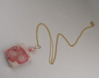 Coral. Flower engraved pink pendant on 14k gold plated chain