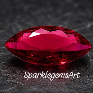 May include: A marquise-cut gemstone with a deep, vibrant red color and multiple facets that reflect light. The stone features a sharp, pointed shape at both ends and is positioned horizontally. The text SparklegemsArt is printed below.