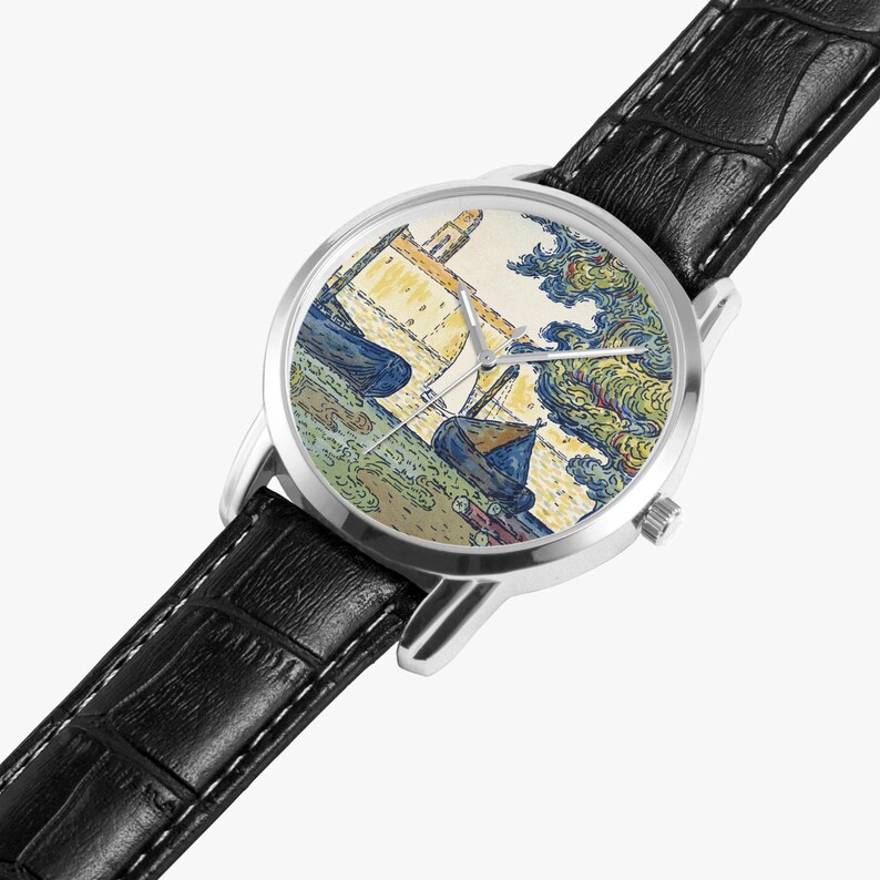 May include: A wristwatch with a silver-colored case and a black leather band. The watch face features a colorful painting of boats and a building. The painting has blue, yellow, and green hues. The watch has silver-colored hands.
