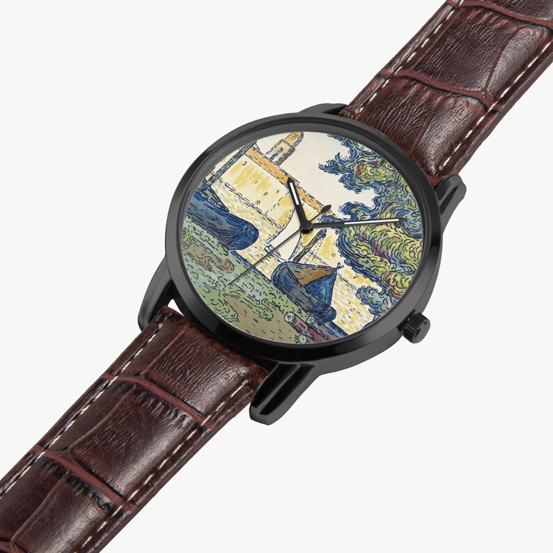 May include: Black wristwatch with a brown leather band. The watch face features a colorful painting of boats and buildings. The watch has a black bezel and a brown leather strap with white stitching.