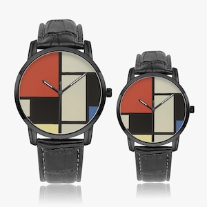 May include: Two black wristwatches with leather straps. The watch faces feature a geometric design with red, black, white, and blue blocks. The watches are displayed on a white surface.