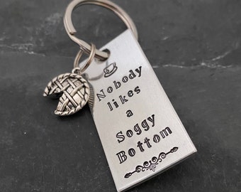 Hand stamped British Baking Show inspired “Nobody likes a soggy bottom” keychain