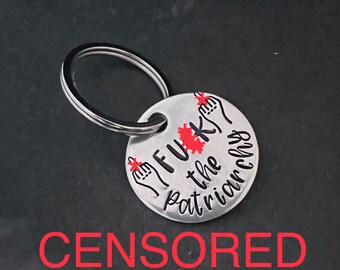 Hand stamped "F the patriarchy” keychain.