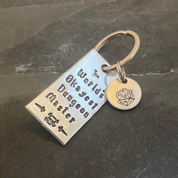 DM inspired worlds okayest dm hand stamped keychain with choice of hand Stamped D20 charm Etsy