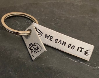 Hand stamped "We can do it!” Rosie the Riveter keychain.