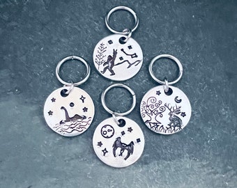 Hand stamped cryptid stitch marker set