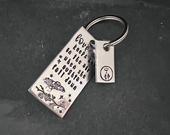 Hand stamped "LOVE keeps her in the air..." Firefly inspired keychain with hand stamped charm