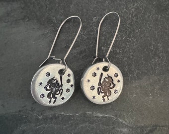 Krampus dancing in the snow hand stamped earrings