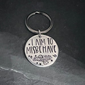 Hand stamped "I aim to misbehave" Firefly inspired keychain