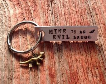 Hand stamped "Mine is an evil laugh" Firefly inspired keychain with dinosaur charm