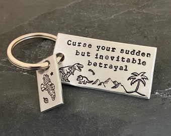 Hand stamped "Curse your sudden but inevitable betrayal" Firefly inspired keychain with serenity charm