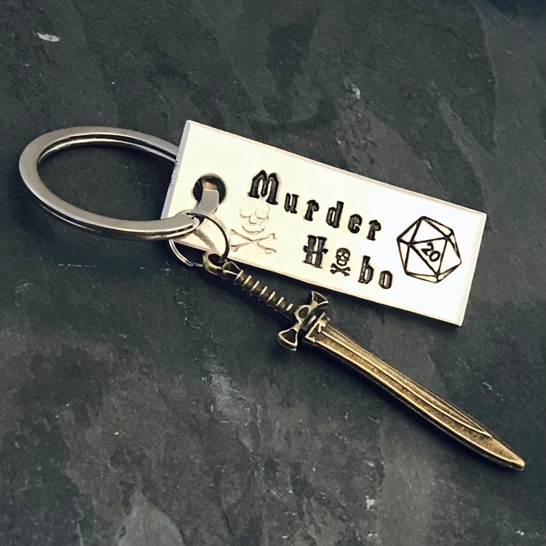 DM inspired Murder Hobo hand stamped keychain with a choice of sword or ax charm Brass sword charm
