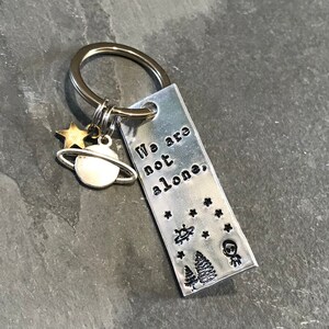 X Files inspired &quot;We are not alone&quot; keychain