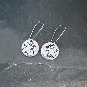 Alien abduction of nessie hand stamped earrings