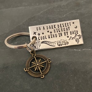 Dark desert Highway RV inspired keychain with a choice of charm