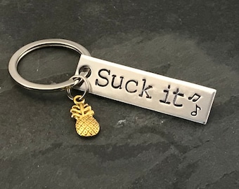 Hand stamped "Suck it” Psych inspired keychain with pineapple charm