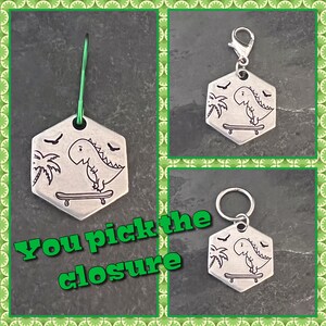 Hand stamped Cutie Trex on skateboard stitch marker